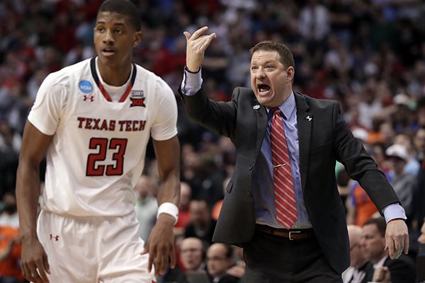 Texas Tech's Jarrett Culver (23) runs up court as head coach Chris Beard, right, gives instructions in the second half of a second-round game against Florida at the NCAA men's college basketball tournament in Dallas, Saturday, March 17, 2018. (AP Photo/Tony Gutierrez)

