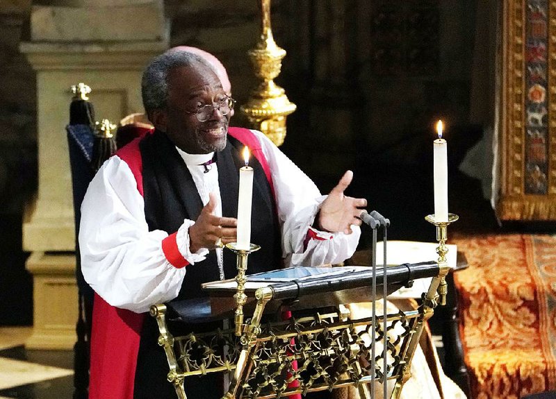 The Most Rev. Bishop Michael Curry, head of the Episcopal Church, speaks during the wedding ceremony of Prince Harry and Meghan Markle at St. George’s Chapel in Windsor Castle in Windsor on May 19. On Thursday, Curry led a procession from National City Church in Washington to the White House for a prayer session he defi ned as nonpartisan. 