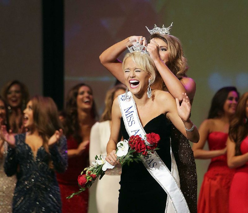 Savvy Shields demonstrates her pageant winning reaction expertise after becoming Miss Arkansas 2016 (shown) and Miss America 2017 two months later. Fayetteville-born Otus the Head Cat’s award-winning column of humorous fabrication appears every Saturday.
