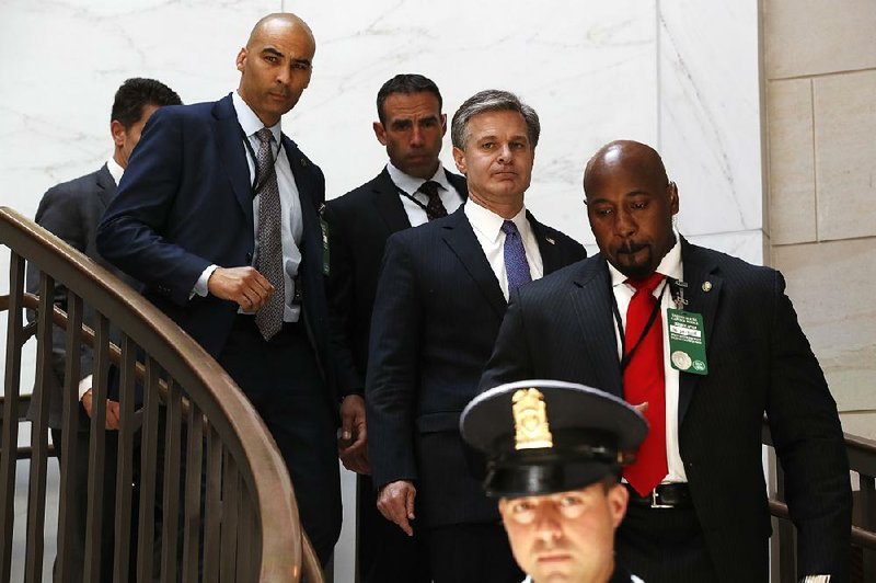 FBI Director Christopher Wray (center) arrives Thursday on Capitol Hill for classified briefings with officials that included White House lawyer Emmet Flood and Chief of Staff John Kelly. 