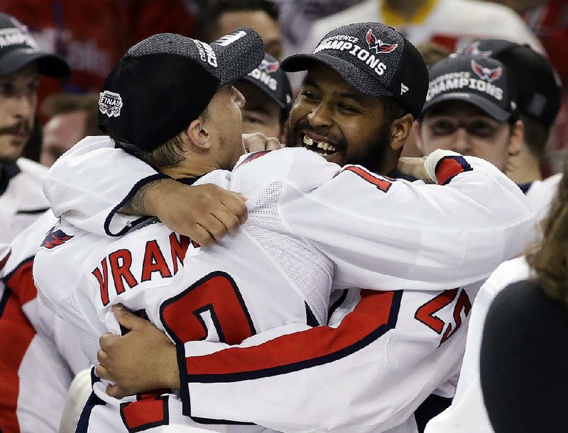 Washington right wing Devante Smith-Pelly (right) celebrates with left wing Jakub Vrana after the Capitals defeated the Tampa Bay Lightning 4-0 on Wednesday in Game 7 of the NHL Eastern Conference final. The Capitals advanced to their first-ever Stanley Cup final, where they will face the Las Vegas Golden Knights beginning Monday.   

