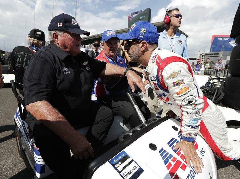A.J. Foyt  talks with driver Tony Kanaan on Saturday at Indianapolis Motor Speedway. Foyt, 83, has been coming to Indy each May since 1958, winning the 500 a record four times.   
