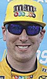 Kyle Busch poses for a photo on Victory Lane after winning the pole position for the NASCAR Cup series auto race at Charlotte Motor Speedway in Charlotte, N.C., Thursday, May 24, 2018.