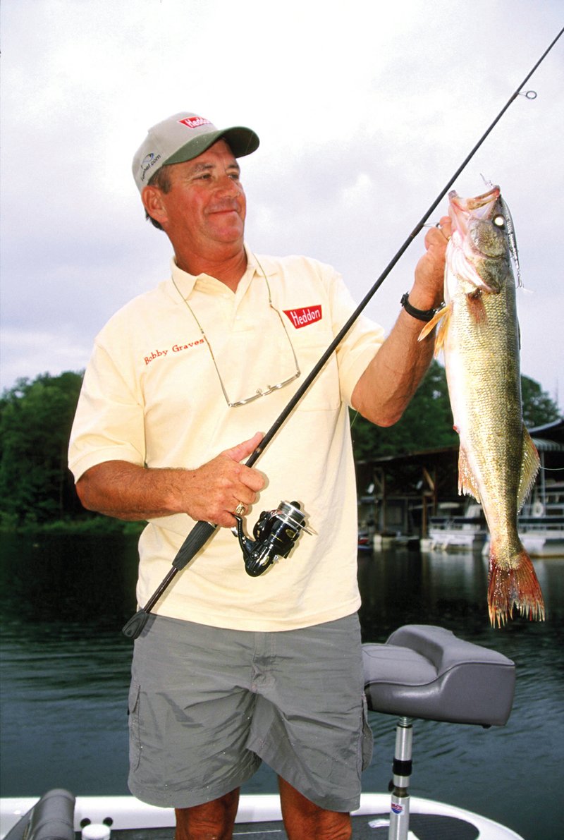 Overcast skies provide conditions conducive to good daytime walleye fishing. Big floating/diving minnow plugs are good enticements, as Bobby Graves of Mount Ida, Ark., knows.