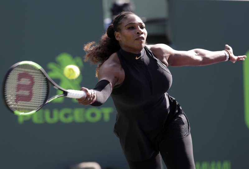 The Associated Press WILLIAMS RETURNS: Serena Williams makes a return against Naomi Osaka, of Japan, during the Miami Open tennis tournament in Key Biscayne, Fla., on March 21. Williams will be competing in the French Open that begins on Sunday in her first Grand Slam event following her maternity leave.