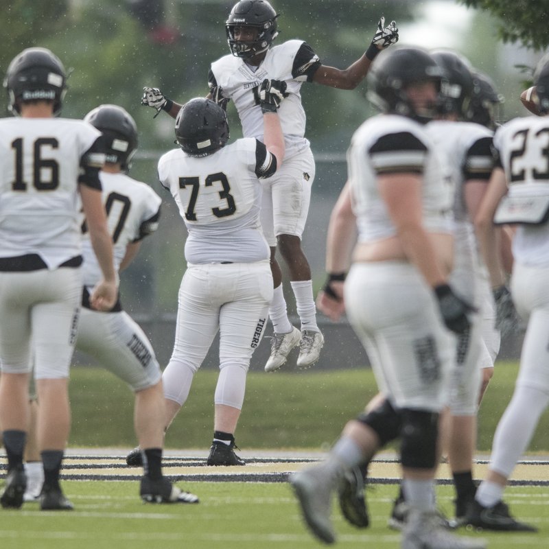 NWA Democrat-Gazette/CHARLIE KAIJO Bentonville High School Preston Crawford (1) reacts after a touchdown during the spring football game, Thursday, May 24, 2018 at Tiger Stadium in Bentonville. 
