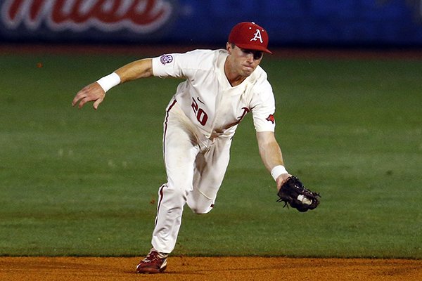Arkansas infielder Carson Shaddy fields a ground ball hit by South Carolina's Madison Stokes during the first inning of a Southeastern Conference tournament NCAA college baseball game Wednesday, May 23, 2018, in Hoover, Ala. (AP Photo/Butch Dill)


