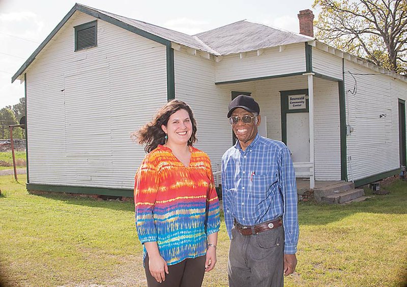 Rachel Patton, executive director of Preserve Arkansas, and Melvin Williams, board member for the Rosenwald Community Cultural Center, stand in front of the Bigelow Rosenwald School in the Toad Suck community. Plans are underway to rehabilitate the school, which was built in 1926 with money from the Julius Rosenwald Fund.