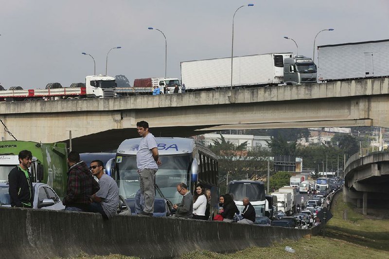 Brazilian truckers protesting rising diesel costs block a highway earlier this week on the outskirts of Sao Paulo. A truckers group said Friday that the number of blockades had reached 521.  