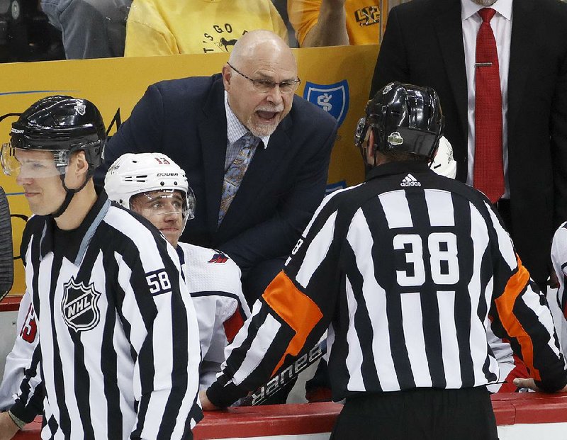 Washington Capitals Coach Barry Trotz talks with referee Francois St. Laurent during the first period of a playoff game against Pittsburgh earlier this month. Trotz went into the season without — and still doesn’t have — a contract for next season. 