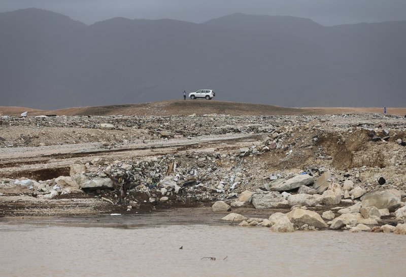 A man visits the flooded area after Cyclone Merkunu in Salalah, Oman, Saturday, May 26, 2018. Cyclone Merkunu blew into the Arabian Peninsula on Saturday, drenching arid Oman and Yemen with rain, cutting off power lines and leaving at least one person dead and 40 missing, officials said. (AP Photo/Kamran Jebreili)