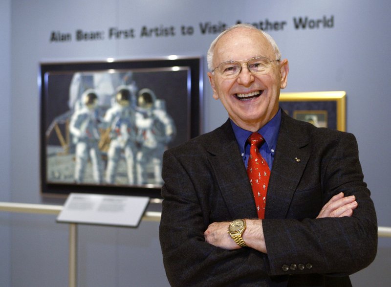 In this Oct. 1, 2008, file photo, Alan Bean, the fourth man to walk on the moon, is shown during a preview of his work at the Lyndon Baines Johnson Library and Museum in Austin, Texas. Bean, the Apollo and Skylab astronaut, fourth human to walk on the moon and an accomplished artist, has died. Bean, 86, died on Saturday, May 26, 2018 at Houston Methodist Hospital in Houston. His death followed his suddenly falling ill while on travel in Fort Wayne, Indiana two weeks before. (AP Photo/Harry Cabluck, File)