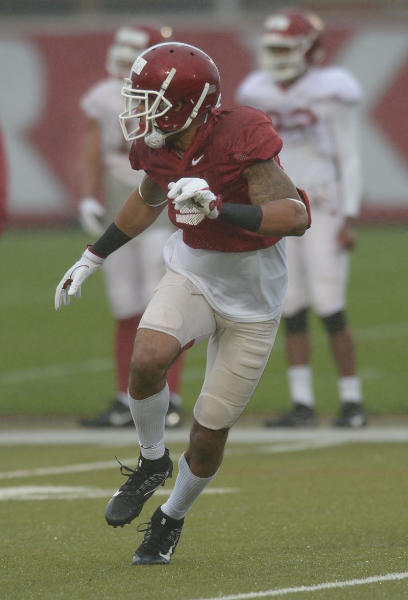 Arkansas defensive back Santos Ramirez takes part in a drill March 28 in Fayetteville. 