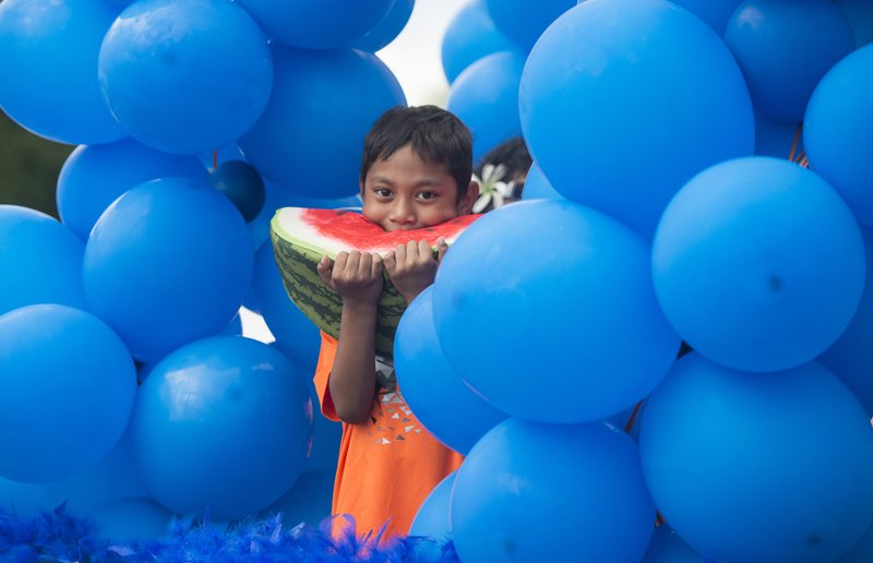 
Markus Hermon, 6, rides on the High Performance Nutrition float Friday, May 25, 2018, during the opening ceremony for the 39th annual Republic of the Marshall Islands Jemenei (Constitution) Day celebration at the Jones Center in Springdale. The celebration continues Saturday with basketball, baseball and other sporting events. 
