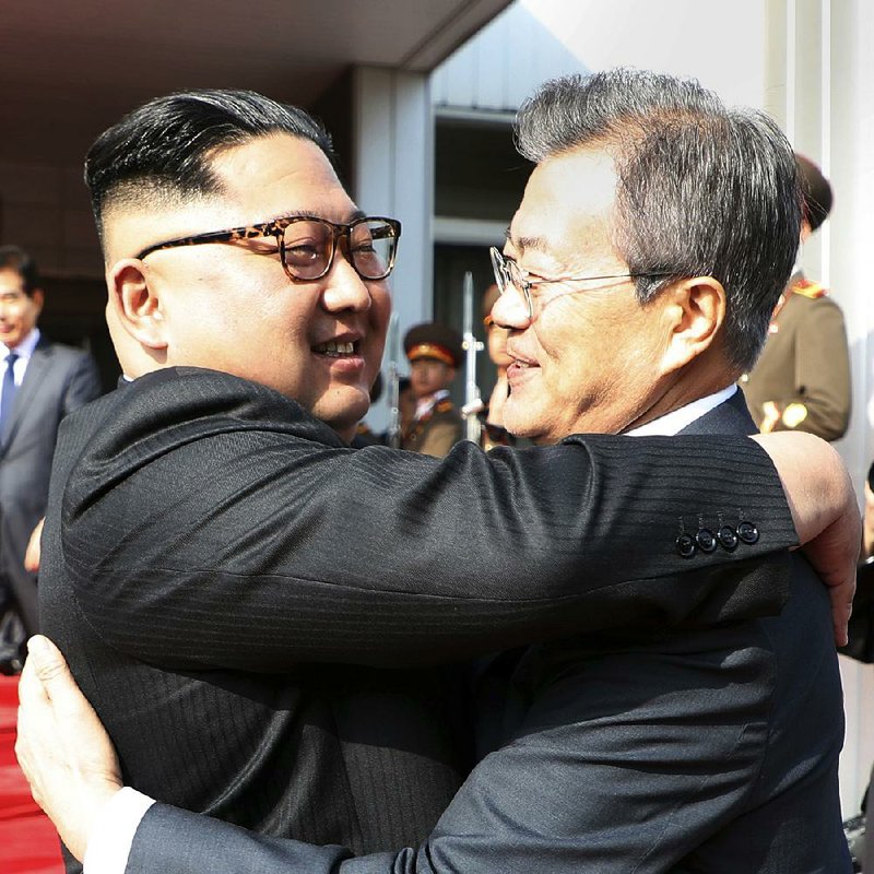 North Korean leader Kim Jong Un (left) and South Korean President Moon Jae-in embrace Saturday after two hours of talks on the north side of Panmunjom in the Demilitarized Zone between their countries.  