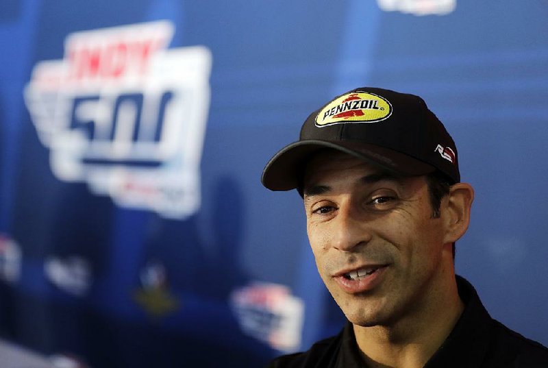 Helio Castroneves, of Brazil, speaks during a media availability for the IndyCar Indianapolis 500 auto race at Indianapolis Motor Speedway, in Indianapolis Thursday, May 24, 2018. 