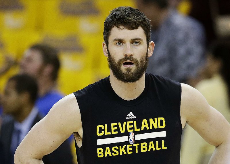 Cleveland Cavaliers forward Kevin Love warms up before Game 2 of basketball's NBA Finals between the Golden State Warriors and the Cavaliers in Oakland, Calif., Sunday, June 5, 2016.