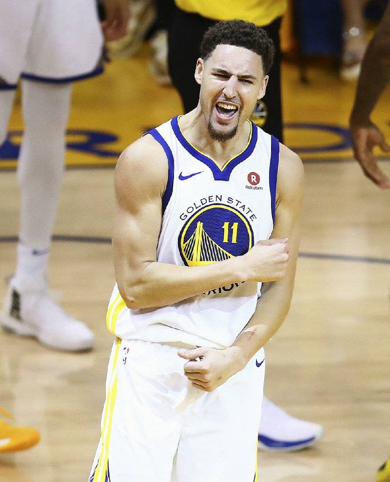 Golden State Warriors guard Klay Thompson (11) celebrates during the second half of Game 6 of the NBA basketball Western Conference Finals against the Houston Rockets in Oakland, Calif., Saturday, May 26, 2018. 