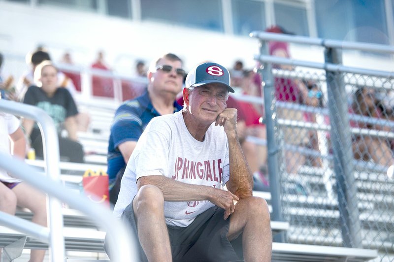Former Springdale High football coach Jarrell Williams watches the Red-White spring football game May 17 at Jarrell Williams Bulldog Stadium in Springdale. 