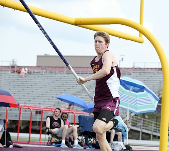 The Sentinel-Record/Grace Brown - Lake Hamilton's Haze Farmer runs to pole vault at the Meet of Champions at Lake Hamilton Wolf Stadium on Saturday, May 12, 2018.