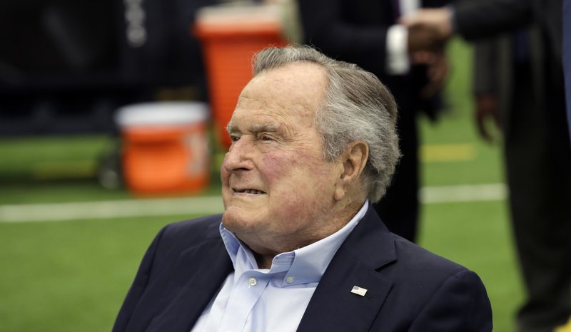 FILE- In this Nov. 5, 2017, file photo, former president George H.W. Bush arrives for an NFL football game between the Houston Texans and the Indianapolis Colts in Houston. (AP Photo/David J. Phillip, File)