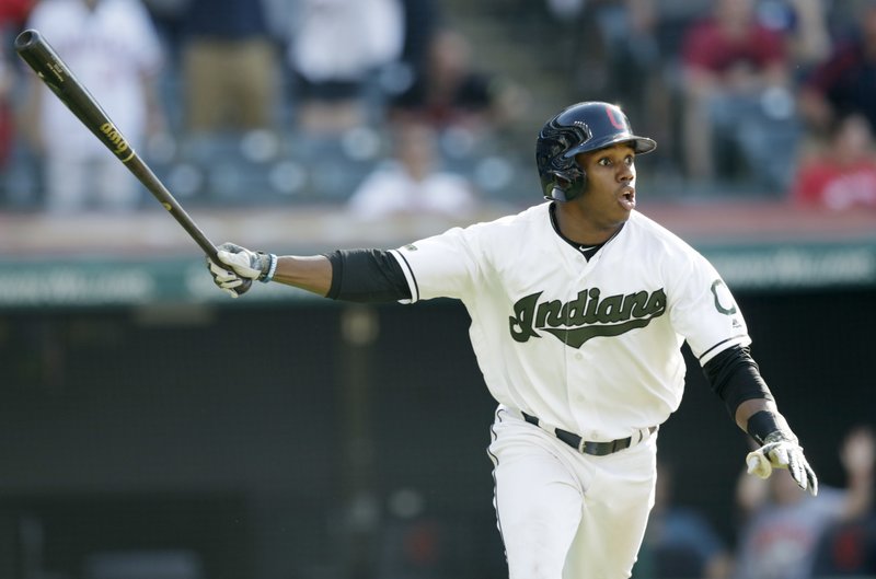 Cleveland Indians' Greg Allen watches his winning solo home run off Houston Astros relief pitcher Brad Peacock in the 14th inning of a baseball game, Sunday, May 27, 2018, in Cleveland. (AP Photo/Tony Dejak)