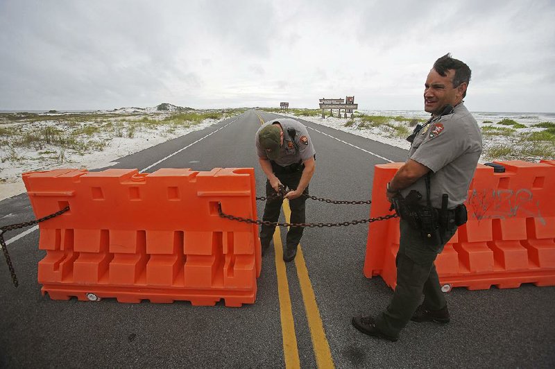 National Park Service rangers close the highway that runs through Gulf Islands National Seashore near Pensacola, Fla., in preparation for Alberto. 
