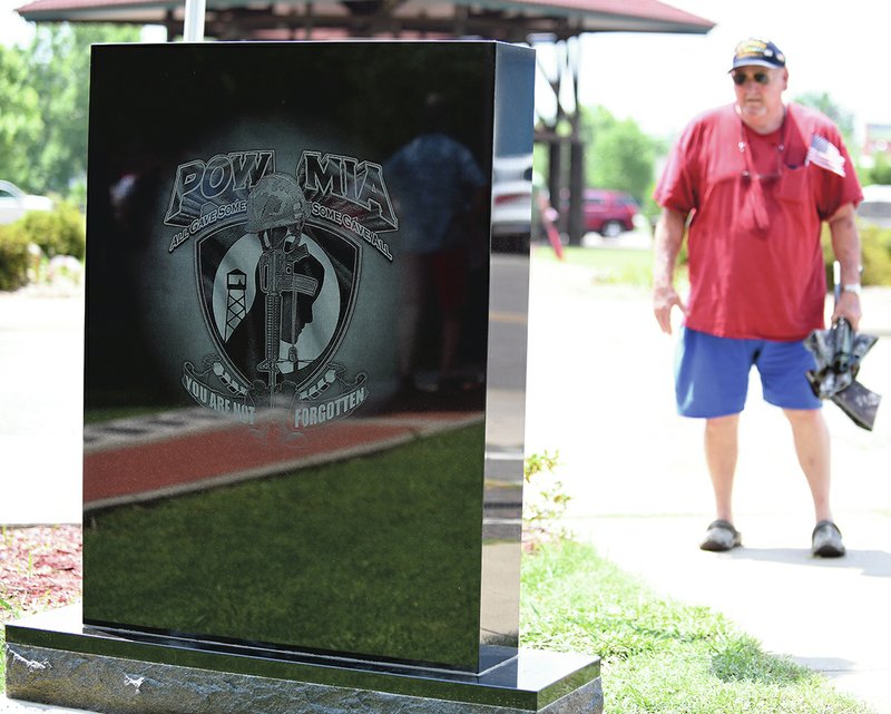 The Sentinel-Record/Grace Brown - Terry Gross, a Vietnam veteran examines the new monument added to the Garland County Veterans Memorial and Military Park recently following the Memorial Day Celebrations at the park on Monday, May 28, 2018. 