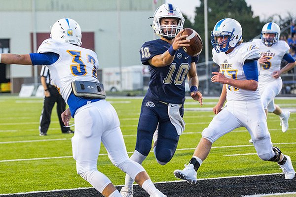 Bentonville West quarterback Will Jarrett (10) runs into the end zone for a touchdown during a game against Pryor, Okla., on Friday, Sept. 1, 2017, in Bentonville.