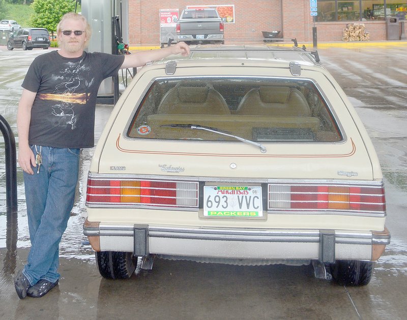 Keith Bryant/The Weekly Vista Justin Brunje stands with his 1985 AMC Eagle wagon.