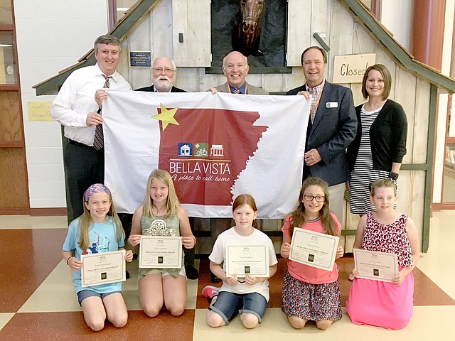 Photo submitted The fourth graders who submitted the top five flag designs for a new city flag met with Mayor Peter Christie (standing, center); two members of the Arts Council, Terry Wilson (standing, second from right) and Dave Barfield (standing, second from left); Cooper principal Chad Mims (standing, left); and teacher Shannon Tweedy (standing, right). The finalists are (seated, left to right) Briley Wooldridge, whose design was chosen; Stella Carpenter; Emilie Roberts; Madeline DeCarlo; and Shanina Levitt.