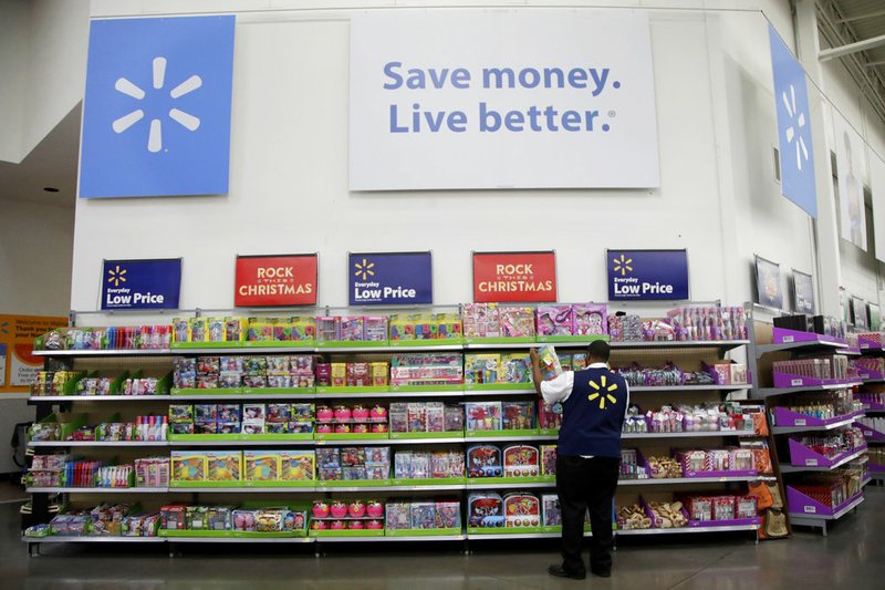 In this Nov. 9, 2017, file photo, a Walmart employee scans items while conducting an exercise during a Walmart Academy class session at the store in North Bergen, N.J. (AP Photo/Julio Cortez, File)
