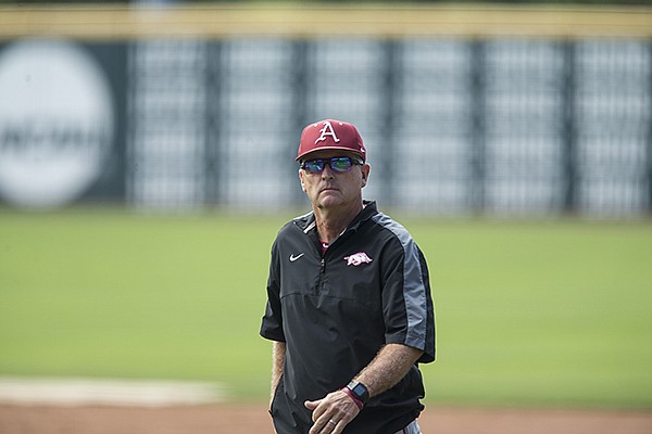 Arkansas coach Dave Van Horn walks across the field during practice Thursday, May 31, 2018, in Fayetteville.
