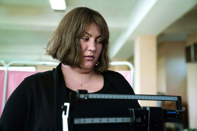 Joy Nash stars as Plum Kettle, a woman struggling with her self-image in the new darkly comedic AMC drama Dietland.  
