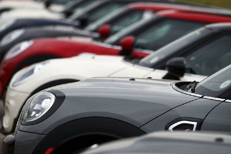 American spending on such things as new vehicles like these Cooper Countryman models at a dealership in Colorado, revved up in April.  