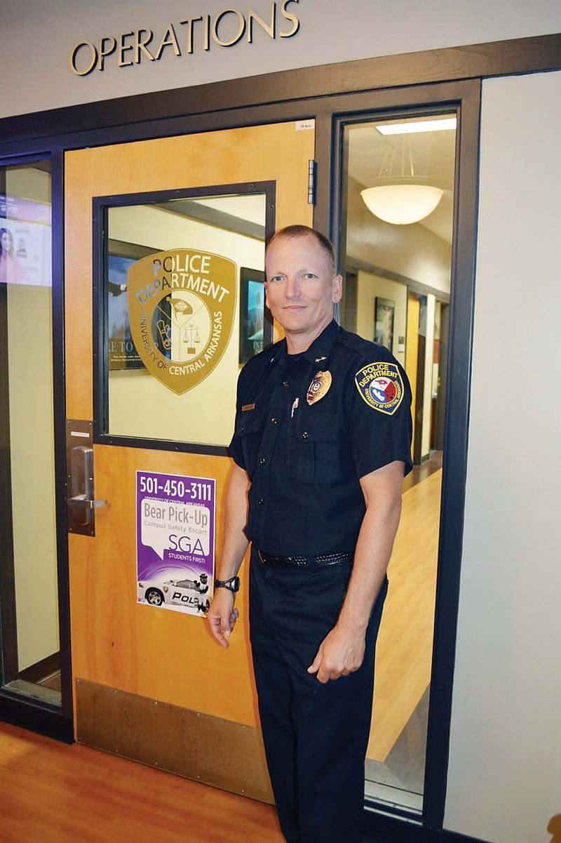 University of Central Arkansas Police Chief John Merguie, who served in the interim position for more than a year before being hired in April, stands in the lobby of the department. Merguie, 50, started 
working at the UCA department in 1991. UCA President Houston Davis called Merguie “an important part of 
our future.”