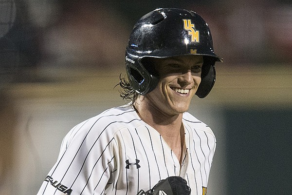 Southern Mississippi's Cole Donaldson smiles after hitting a three-run homer in the sixth inning against Dallas Baptist during an NCAA college baseball tournament regional game Friday, June 1, 2018, in Fayetteville, Ark. (Ben Goff/The Northwest Arkansas Democrat-Gazette via AP)