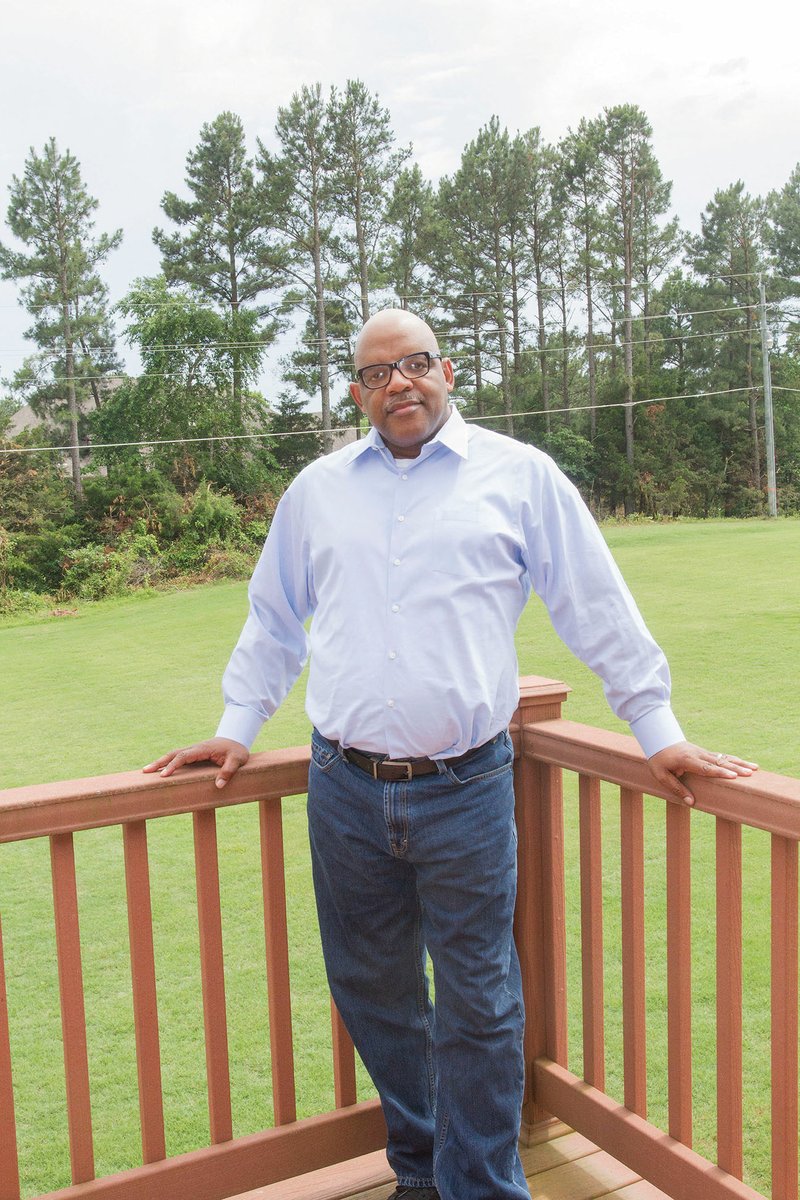 Joe Washington, chairman of the Democratic Party of White County, stands on the back deck of his home in Searcy. Washington, a former bank examiner for the FDIC, retired in 2015 after being diagnosed with muscular dystrophy a few years prior. He became involved with the Democratic Party in White County in 2017 and was elected chairman Jan. 15.