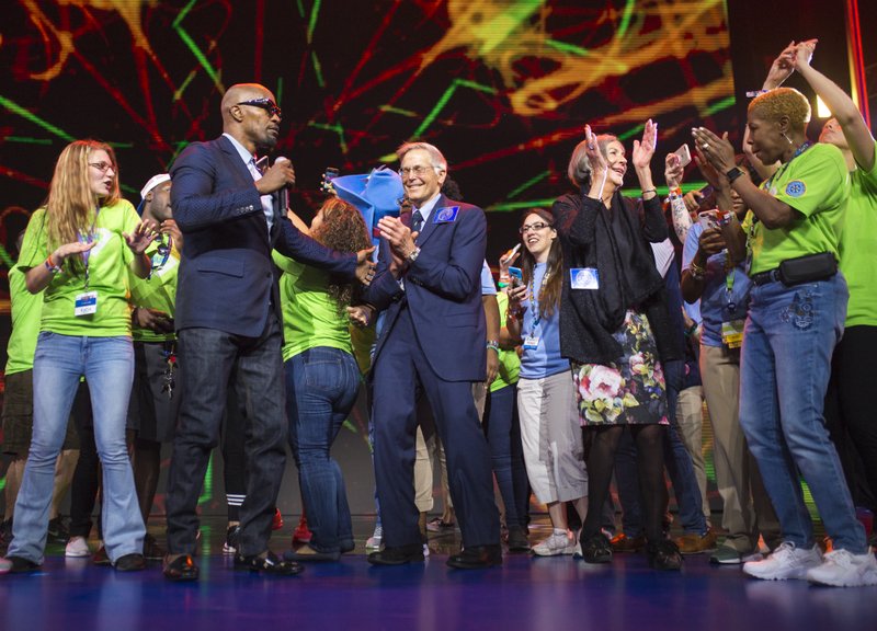 Jamie Foxx brings up Walton family members to dance with Walmart team members during the annual Walmart shareholders meeting, Friday, June 1, 2018 at Bud Walton Arena in Fayetteville. 

