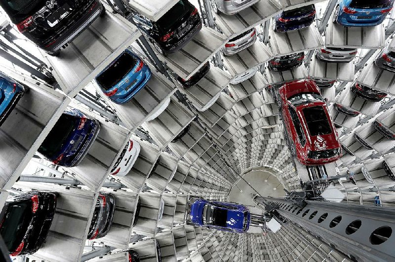 Volkswagen cars are lifted inside a delivery tower at a plant in Wolfsburg, Germany. New U.S. tariffs on metals from the European Union and other allies have given rise to threats of retaliation.  
