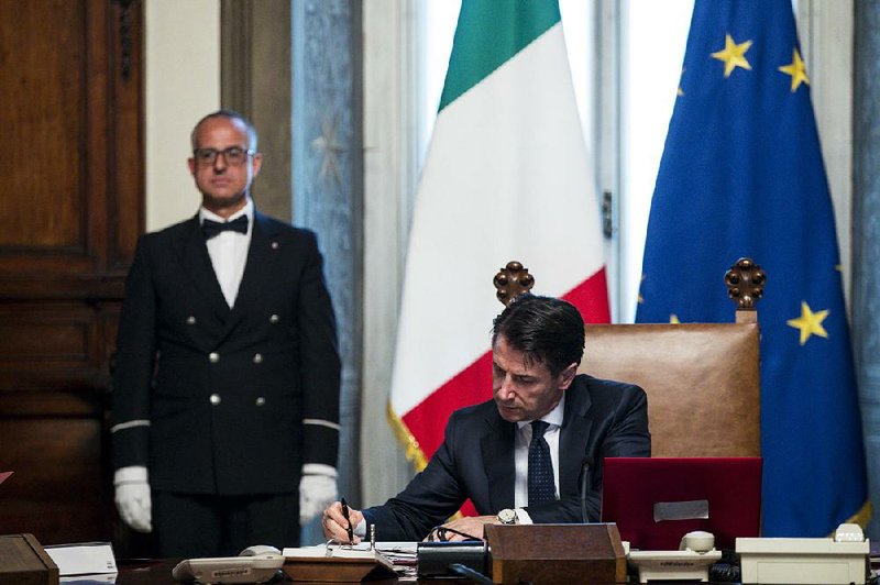 New Italian Premier Giuseppe Conte opens his first Cabinet meeting Friday at Chigi Palace in Rome.  
