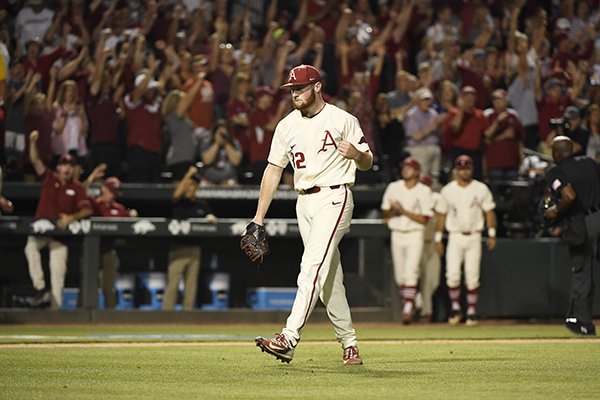 Arkansas pitcher Matt Cronin celebrates after the Razorbacks beat Dallas Baptist 4-3 in a college baseball game in the NCAA regional tournament Sunday, June 3, 2018 in Fayetteville, Ark. (AP Photo/Michael Woods)

