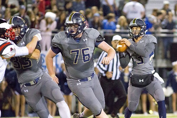Shiloh Christian offensive lineman Logan Kallesen (76) pulls to block while quarterback Connor Reece prepares to throw during a game against Pea Ridge on Friday, Nov. 5, 2015, in Springdale.