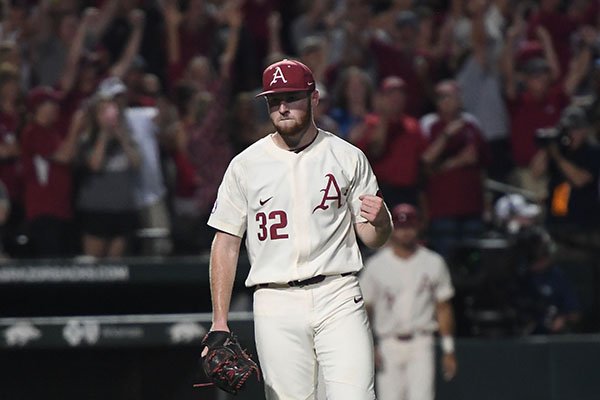 Arkansas pitcher Matt Cronin fist bumps after recording the final out of an NCAA Tournament game against Dallas Baptist on Sunday, June 3, 2018, in Fayetteville. 