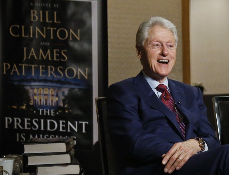 In this Monday, May 21, 2018 photo, former President Bill Clinton speaks during an interview about a novel he wrote with James Patterson, "The President is Missing," in New York.
