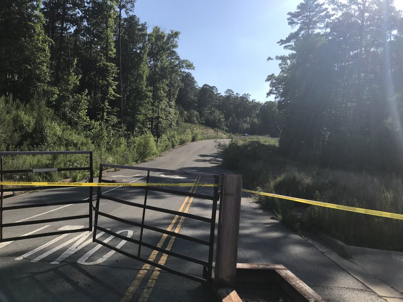 Police tape marks off the area where a body was found off Rahling Road in west Little Rock on Tuesday, June 5, 2018.