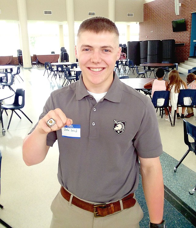 MARK HUMPHREY ENTERPRISE-LEADER Zeke Laird, a 2017 Prairie Grove graduate and Army officer in training at West Point, displays a National Championship ring won while playing offensive lineman as part of the Army's Sprint Football team.