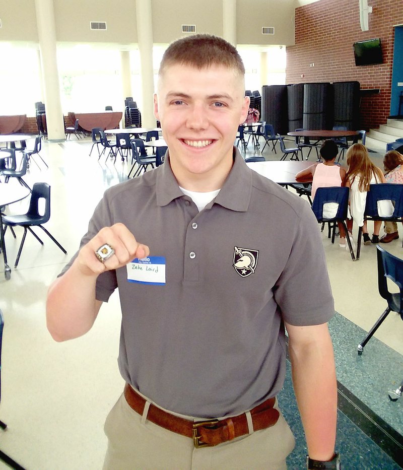 MARK HUMPHREY ENTERPRISE-LEADER Zeke Laird, a 2017 Prairie Grove graduate and Army officer in training at West Point, displays a National Championship ring won while playing offensive lineman as part of the Army's Sprint Football team.