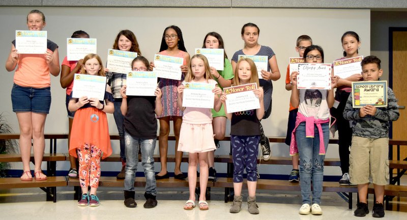 Westside Eagle Observer/MIKE ECKELS Members of Holly Denton's fourth-grade class display their certificates during the awards assembly at Northside Elementary May 18 in the school's cafeteria in Decatur.