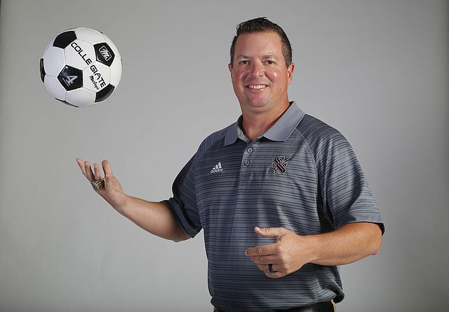David Gottschalk/NWA Democrat-Gazette Brent Crenshaw of Siloam Springs was named the Northwest Arkansas Democrat-Gazette's GIrls Soccer Coach of the Year for the 2018 season after leading the Lady Panthers to their fifth consecutive Class 6A state championship.